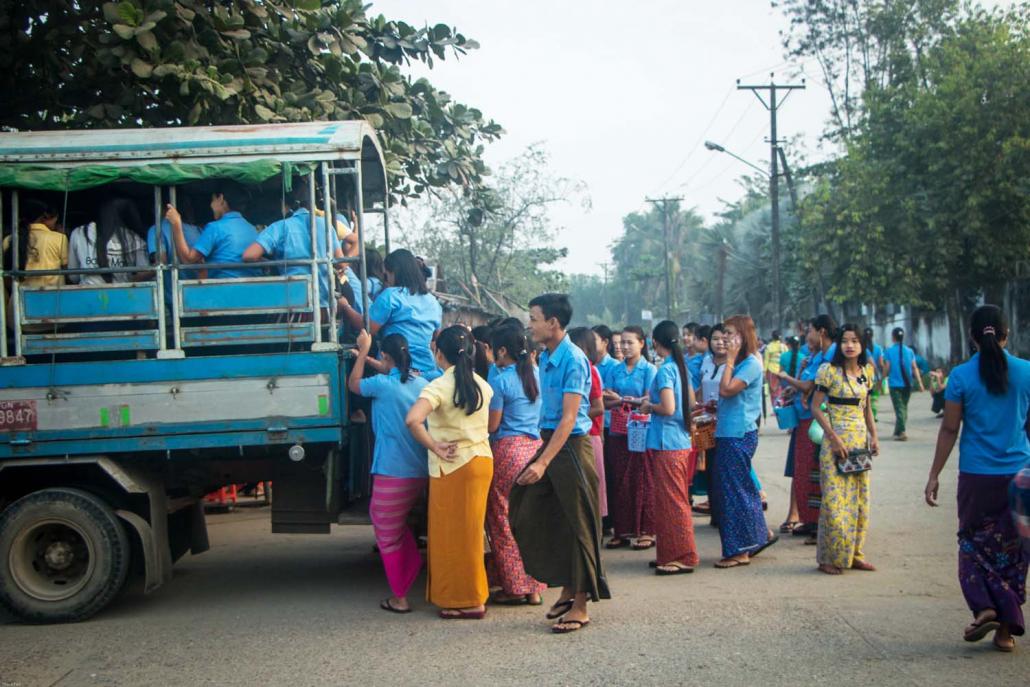 Factory workers go to work in the Shwe Lin Ban Industrial Zone in Hlaing Tharyar Township, Yangon. (Thuya Zaw | Frontier)