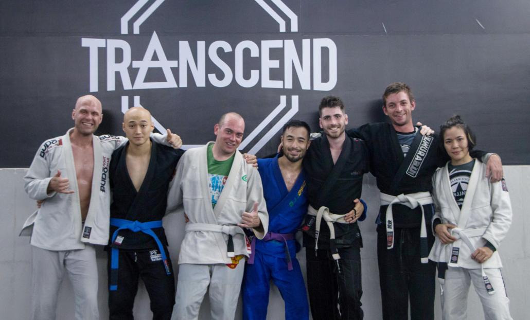Members of downtown Yangon's Transcend Fitness gym, including Joey Kyaw (second left), post for a photo following a recent BJJ session (Thuya Zaw | Frontier)