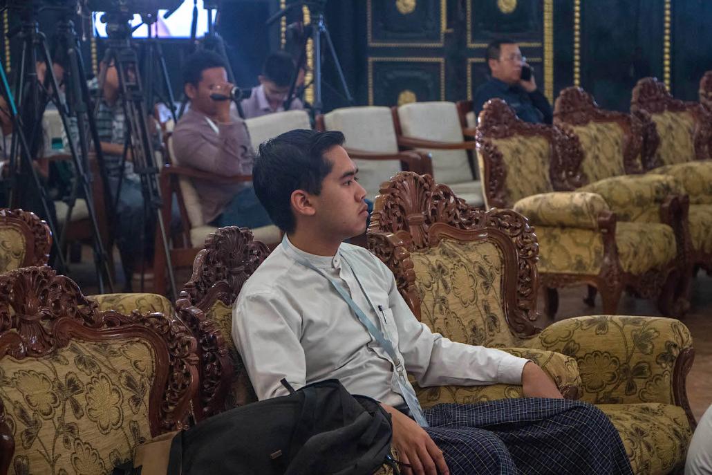 Ko Aung Khant listens to the election results at City Hall. (Thuya Zaw | Frontier)