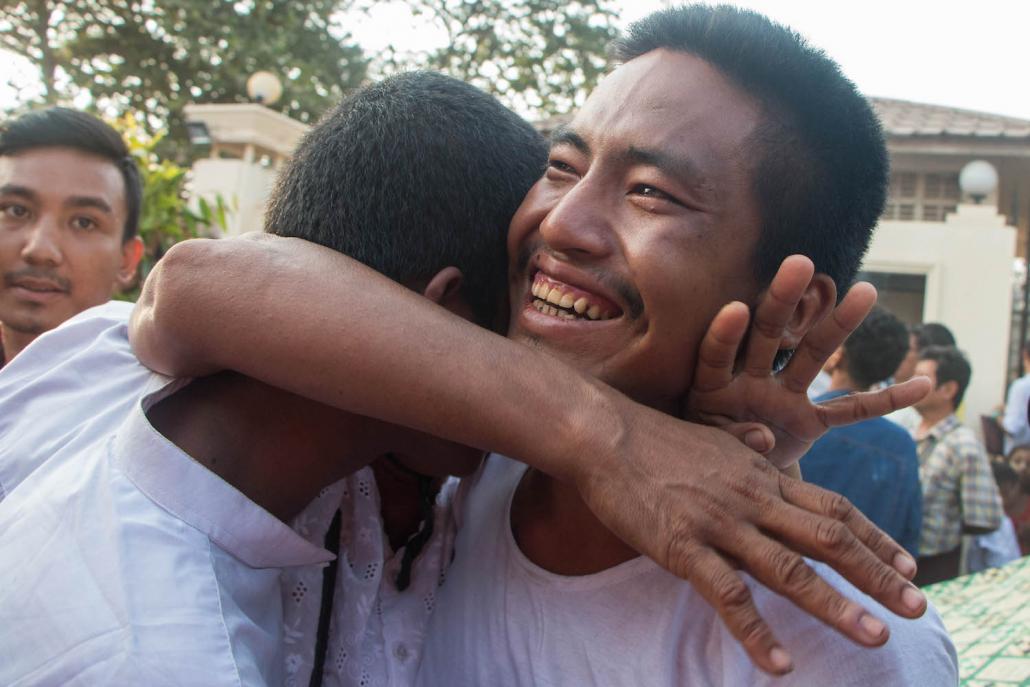 A mothers hug two of her sons who were freed from Insein Prison on April 17. (Thuya Zaw | Frontier)