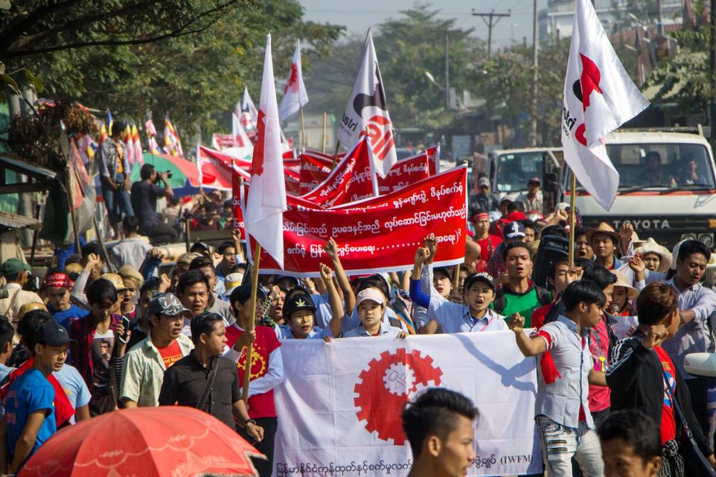 Hundreds protest the sudden shutdown of a factory supplying Adidas, 18 January. (Thuya Zaw | Frontier)