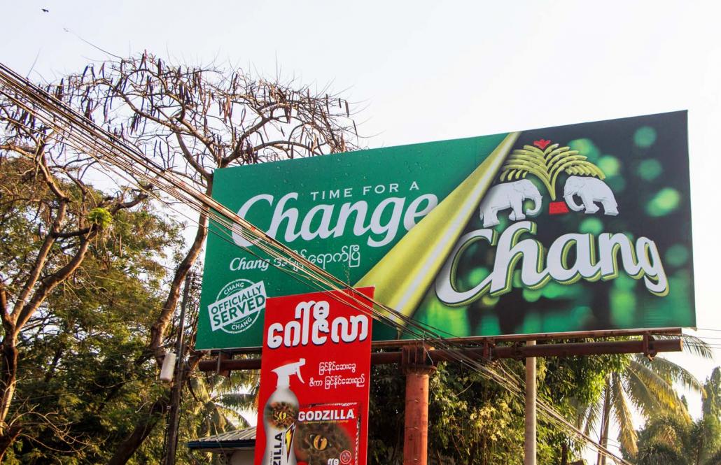 The only sign in Myawaddy that Chang is being brewed in Myanmar are billboards announcing it is now "officially served". (Thuya Zaw | Frontier)