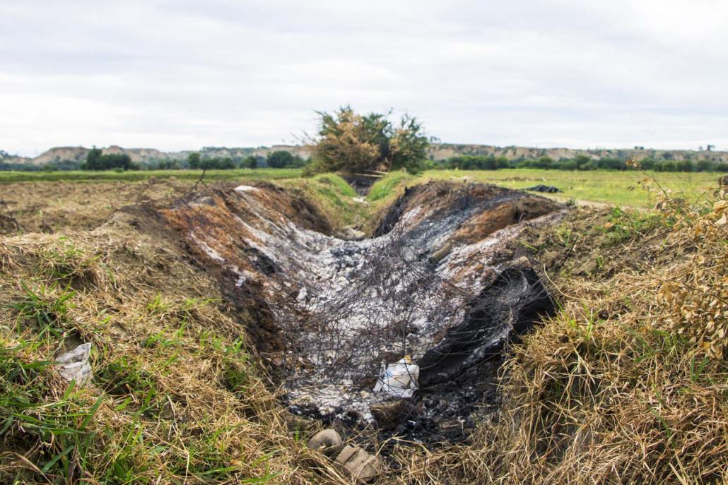 A ditch near Phaye Kyun where the authorities hurriedly cremated the bodies of residents who were killed in the fighting on July 23 or subsequently drowned. (Thuya Zaw | Frontier)