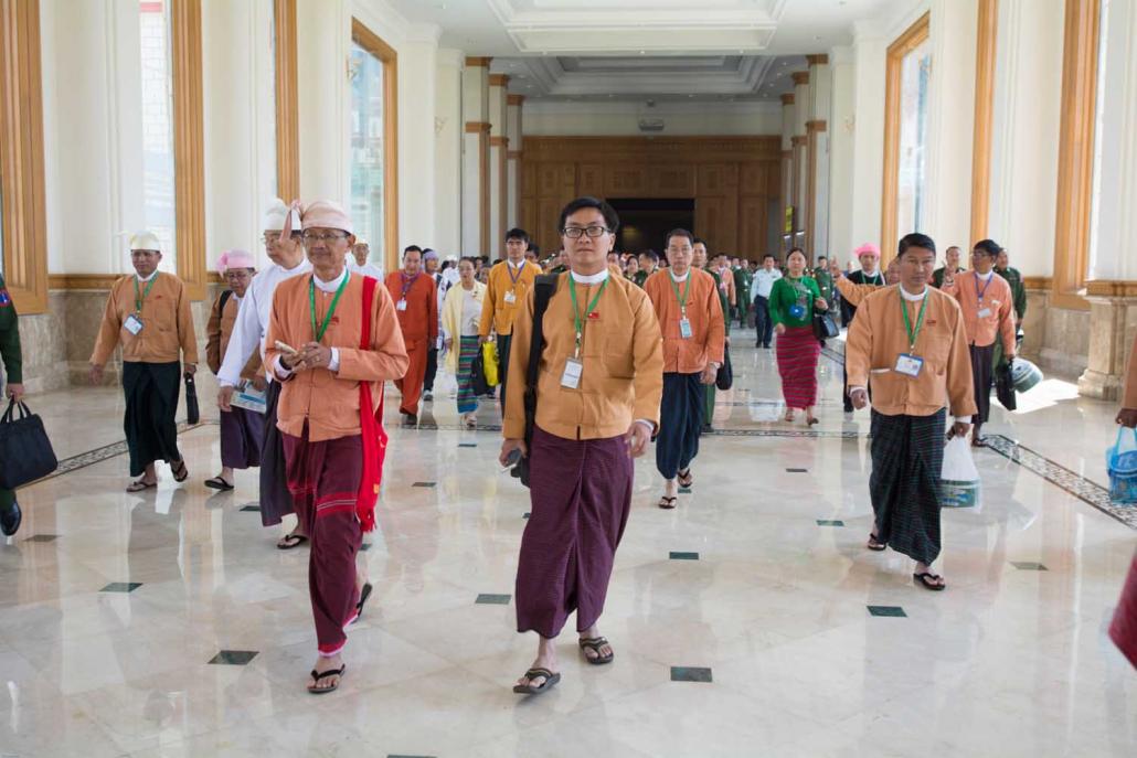 Lawmakers walk through the corridors of parliament in Nay Pyi Taw on January 31, 2016, the day they were sworn into office. (Teza Hlaing | Frontier)