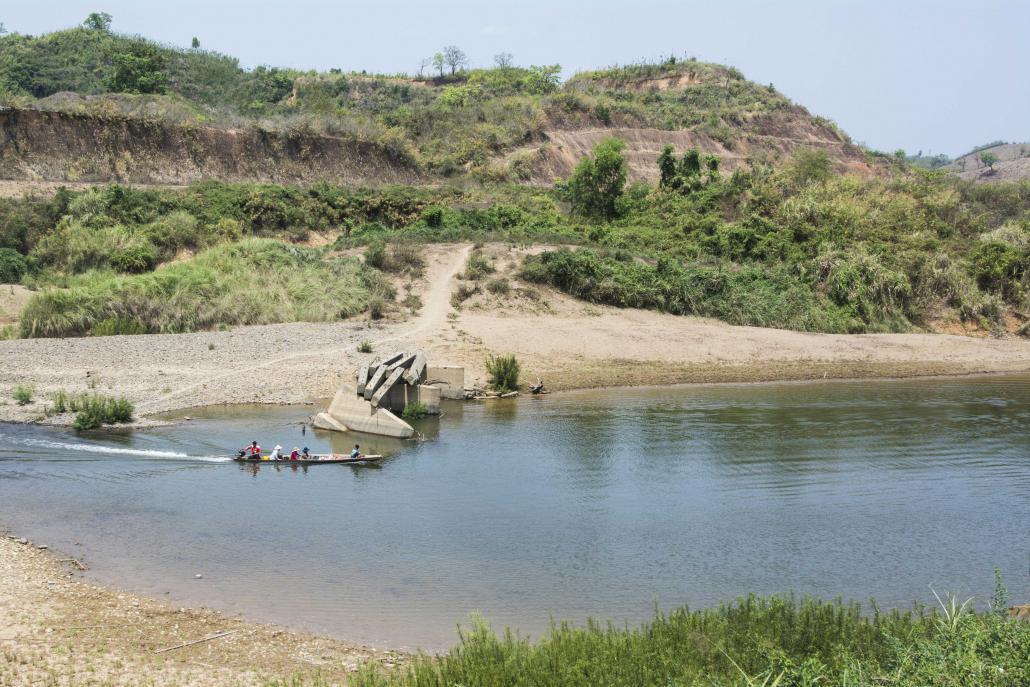 The overgrown dam walls at the abandoned Ann hydropower project. (Teza Hlaing | Frontier)