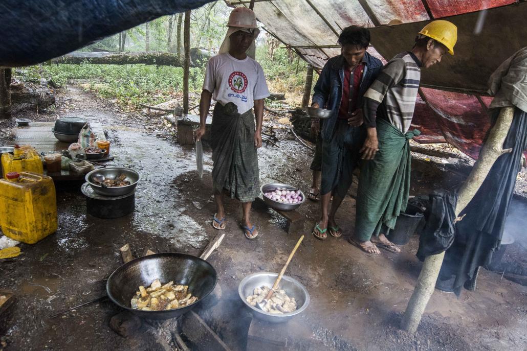 Men work on Myanmar's national electricity grid in Magway Region. (Teza Hlaing / Frontier)