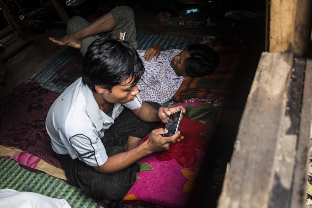 Men work on Myanmar's national electricity grid in Magway Region. (Teza Hlaing / Frontier)