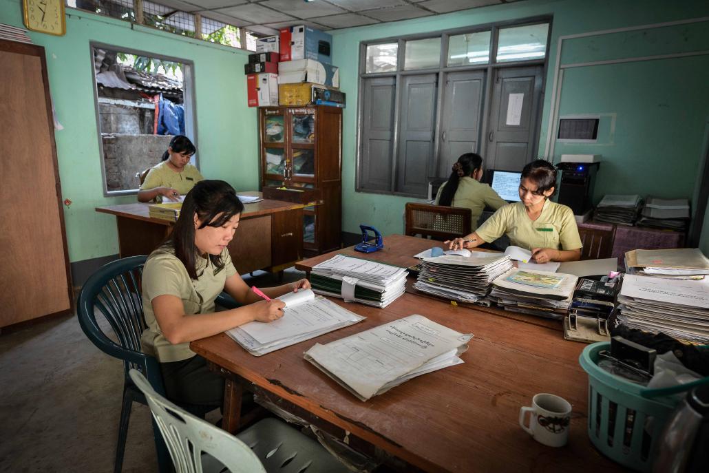 Employees from the General Administration Department in an eastern Yangon office in Eastern Yangon. (Teza Hlaing / Frontier)