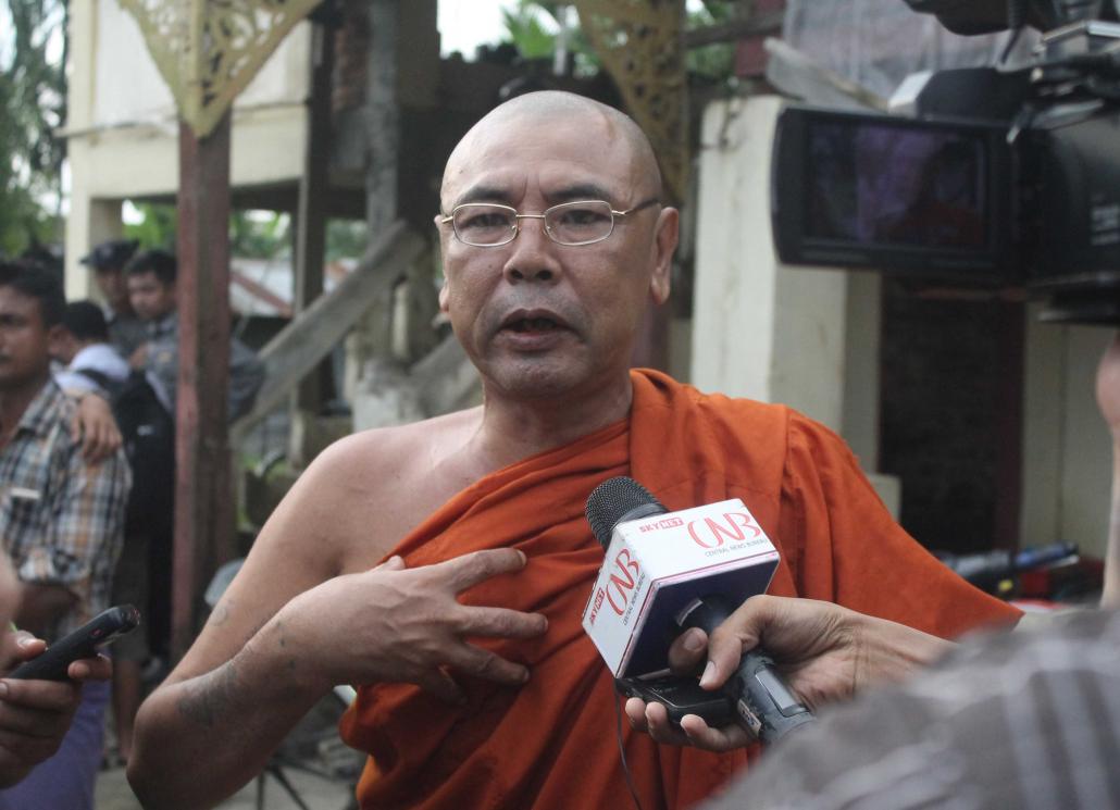 A monk told reporters he had seen Muslims setting fire to homes, but evidence later emerged that the photos had been staged. (Nyan Hlaing Lynn | Frontier)