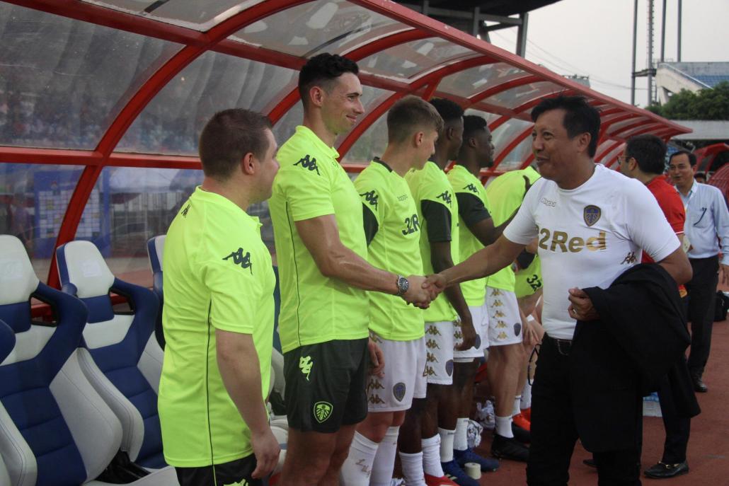 Chair of the Myanmar Football Federation U Zaw Zaw meets Leeds United players before the match. (Nyein Su Wai Kyaw Soe | Frontier)