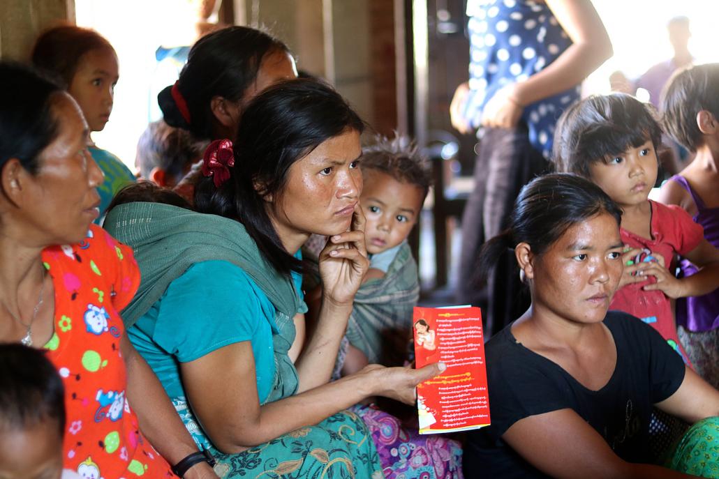 A group of women listen to a presentation by Marie Stopes International about reproductive health in Chin State. (Charlotte England / Frontier)