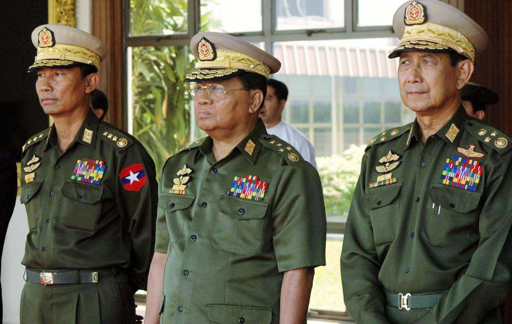 U Shwe Mann (left), then joint chief-of-staff of the armed forces, stands alongside Senior General Than Shwe (centre) and Vice Senior General Maung Aye (right) at an event in Yangon on March 11, 2006. (AFP)