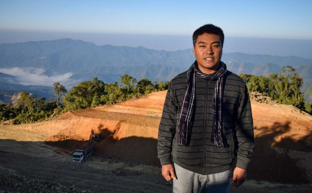 Dr Sakie stands in front of the under-construction airstrip at Lailenpi. (Kyaw Lin Htoon | Frontier)