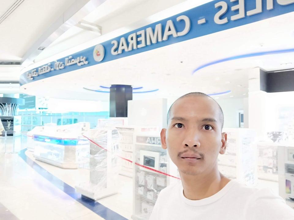 Ko Khant Oo Maw takes a selfie in Dubai International Airport, where he has been stuck since being denied permission to board his flight to Singapore early on March 24. (Supplied)