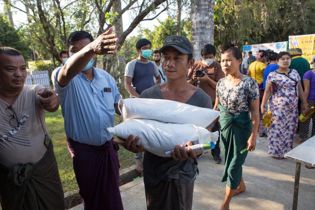 Industry associations organised an event in Hlaing Tharyar on March 26 to sell rice, oil and other basic commodities to residents at reduced prices. (Thuya Zaw | Frontier)