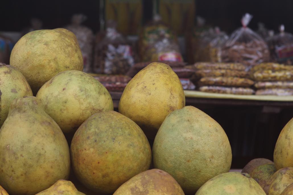 Pomelos for sale beside the Yangon-Mawlamyine Highway. Fruit traders say prices have more than halved in recent months as a result of COVID-19. (Thomas Kean | Frontier)