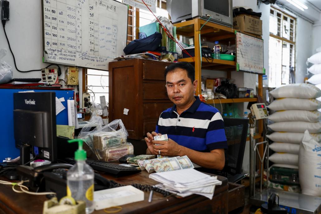 Rice trader U Aung Min Lwin said that despite the high demand on March 24 in Yangon's Sanchaung Township, he was not tempted to raise his prices. (Nyein Su Wai Kyaw Soe | Frontier)