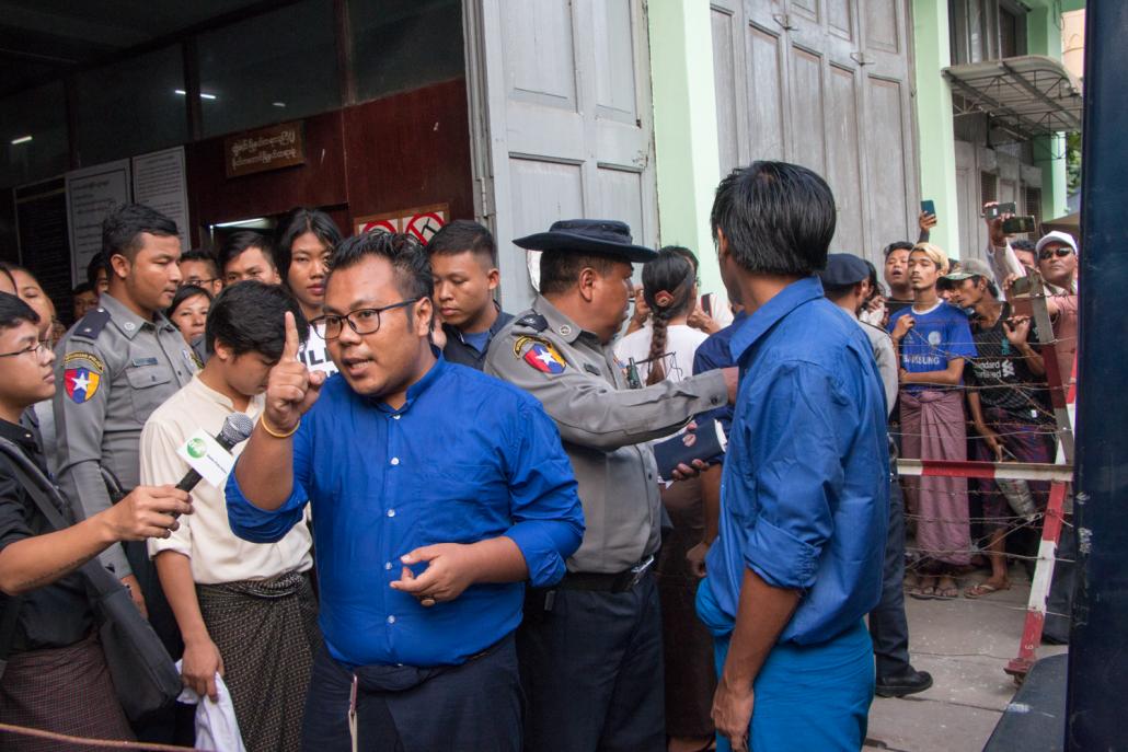 Ko Paing Ye Thu (centre, with glasses) attends a court in Yangon with other Peacock Generation members on November 18, 2019. (Thuya Zaw | Frontier)