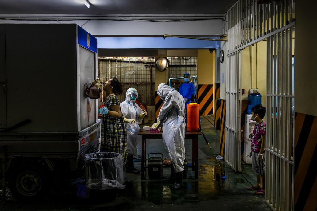 Since being assigned to collect samples in Yangon on April 24, the Department of Medical Research team has not taken a single day off. (Hkun Lat | Frontier)