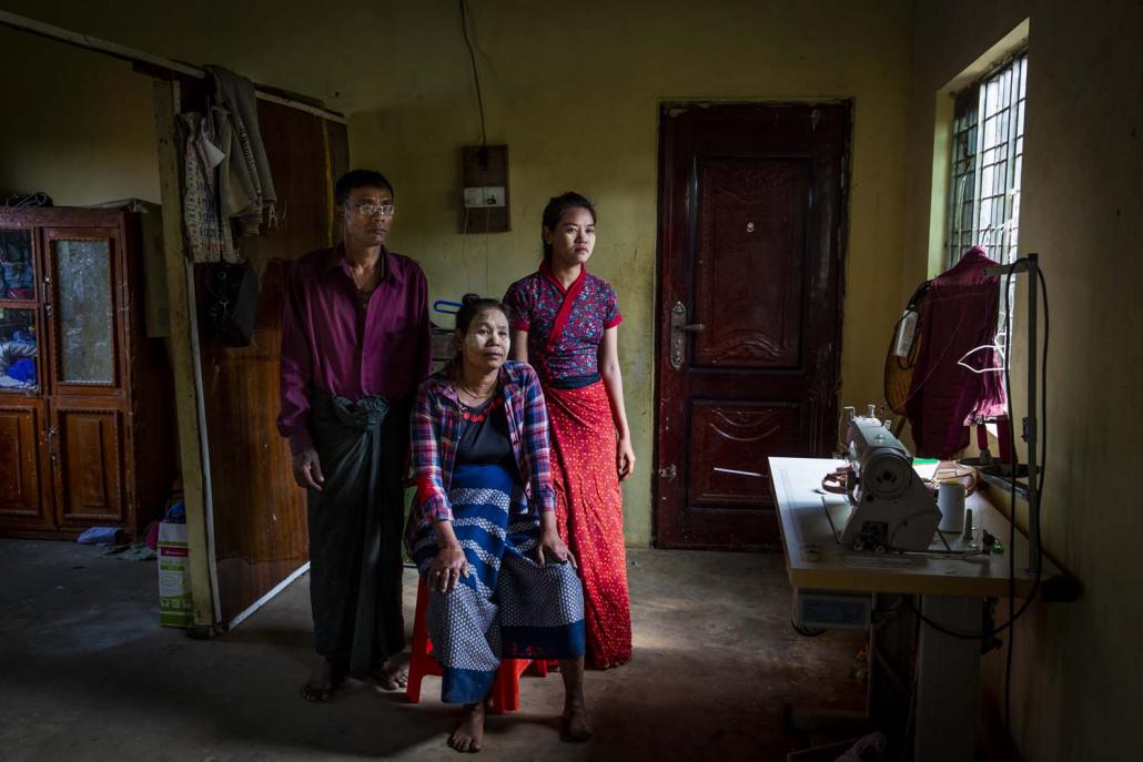 Ko Pauk Sa with his family at their resettlement home in Kyauktan. (Hkun Lat | Frontier)