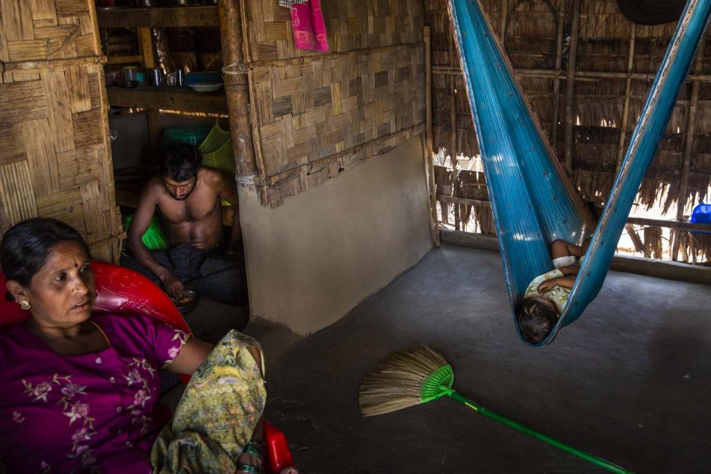 Residents who have refused compensation are seen at their house beside the new Thilawa Special Ecomonic Zone B in Thanlyin on February 19. (Hkun Lat | Frontier)