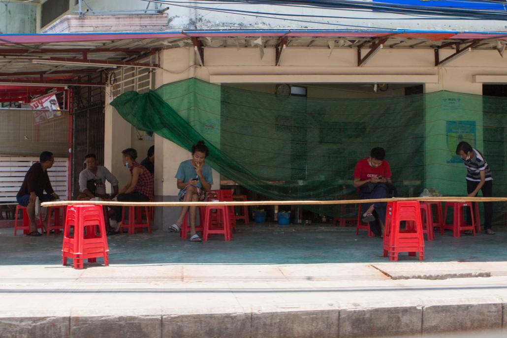 Customers at a teashop in Yangon on May 13. Some teashops have quietly reopened with the tacit approval of local officials. (Thuya Zaw | Frontier)