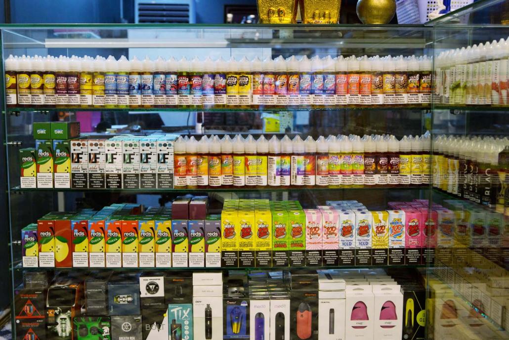 E-cigarettes on display at a store in Yangon. Also known as vapes, they have largely gone under the radar in Myanmar, although the first vape shop opened in 2014. (Thuya Zaw | Frontier)