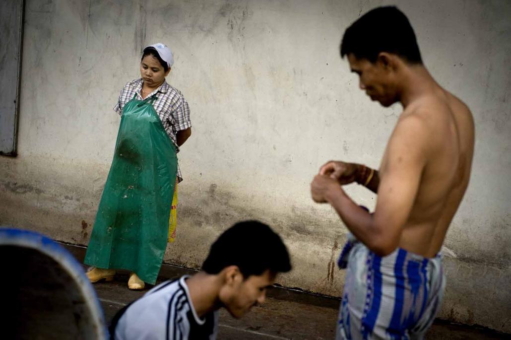 Workers take a break at a shrimp factory in Mahachai, on the outskirts of Bangkok. (AFP)