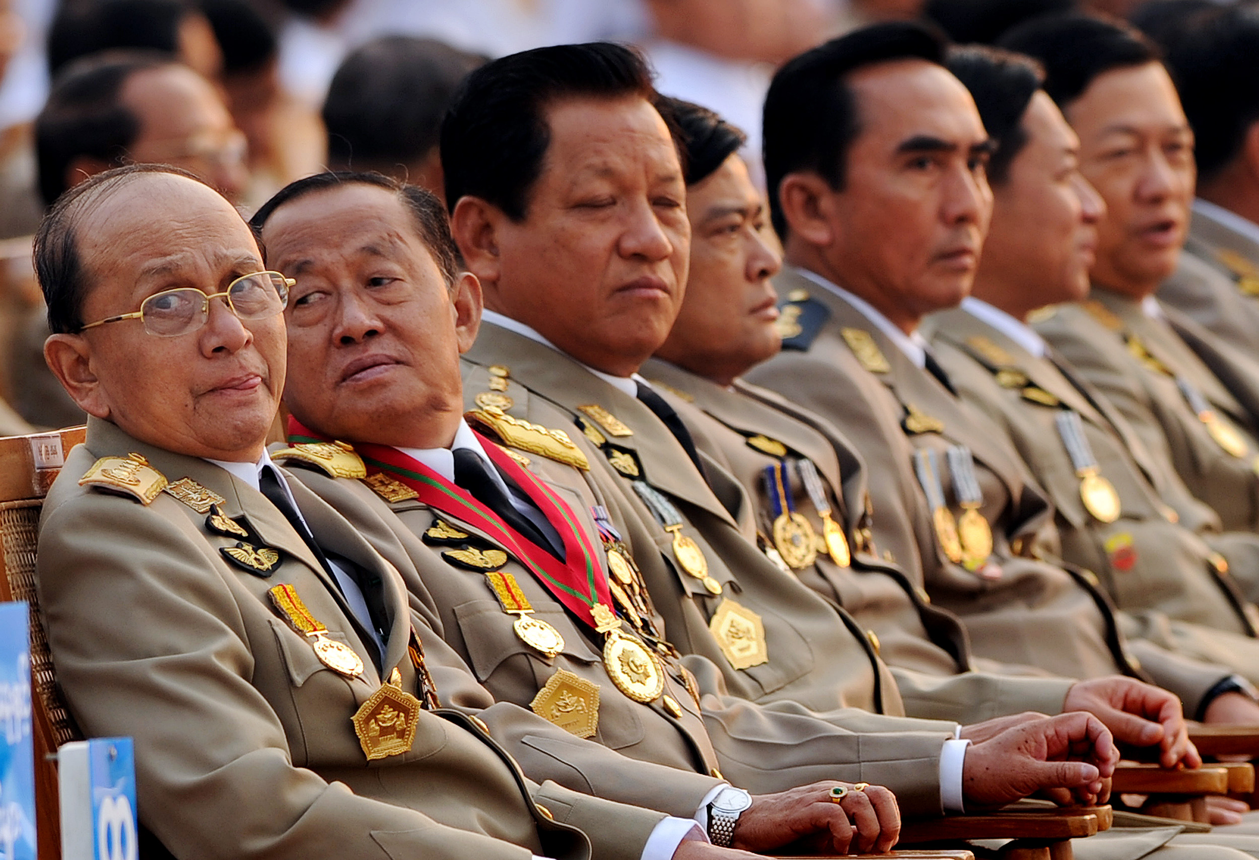 Thein Sein, left, along with senior leaders attends a military parade marking the country's 65th Armed Forces Day at a parade ground in Nay Pyi Taw on March 27, 2010. (Christophe Archambault / AFP)