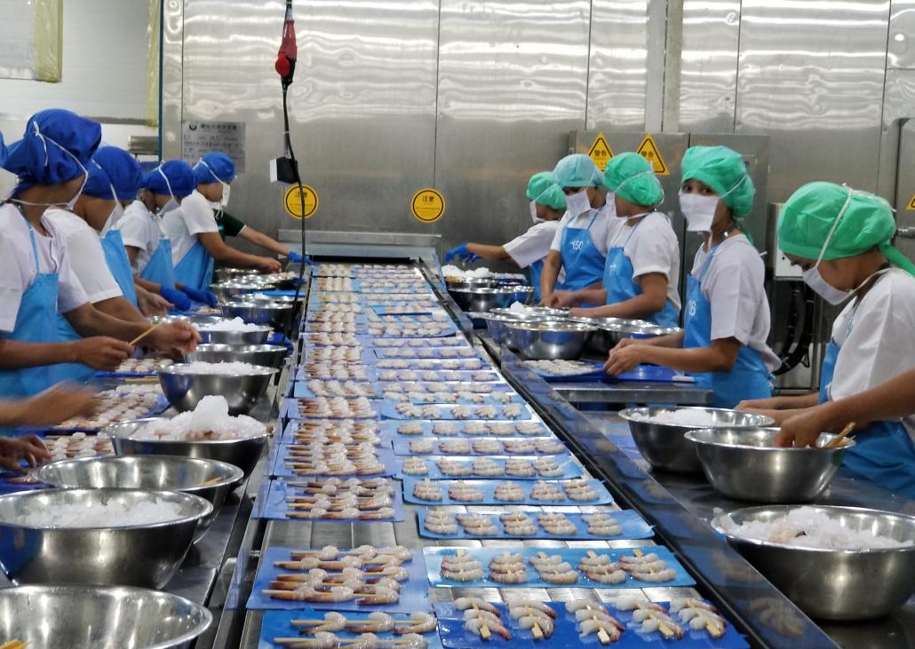 Workers at the Golden Bay seafood processing plant at Yangon’s Insein Township. (Supplied | Frontier)