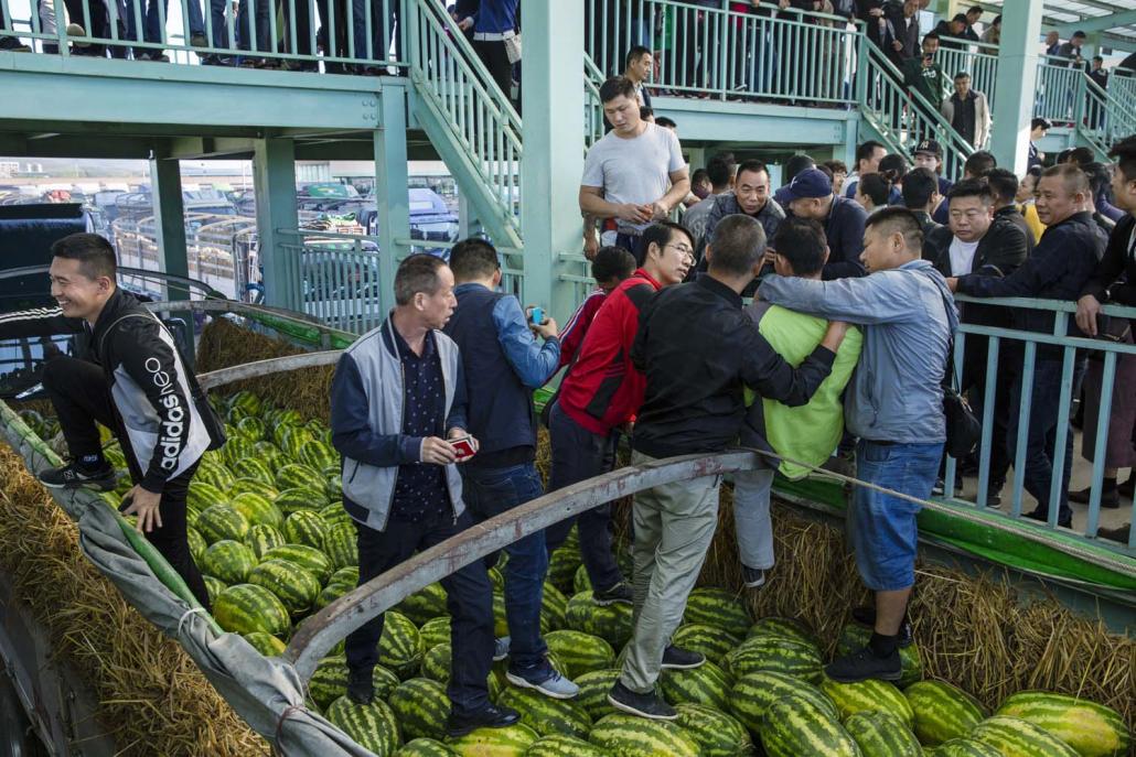 Chinese buyers jostle to buy Myanmar watermelons at the border town of Muse on November 19, 2019, before the coronavirus outbreak hit border trade. (Hkun Lat | Frontier)