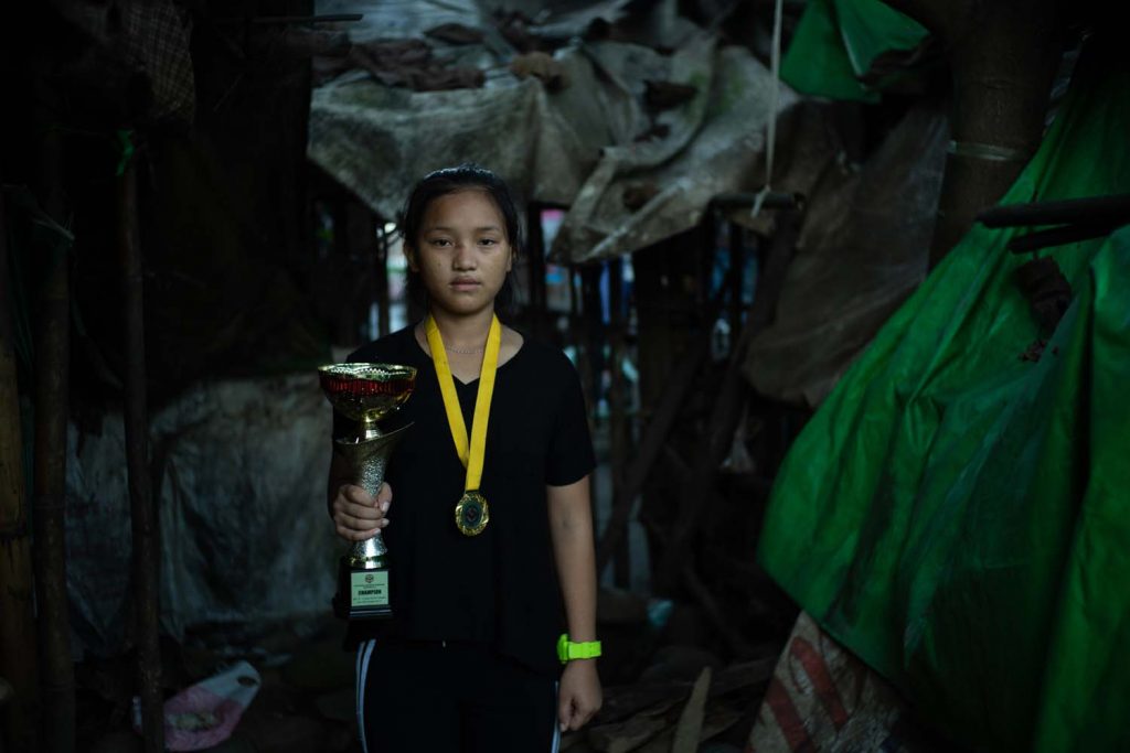 Seng Nu fled her village of Ta Law Gyi in 2011. Living at the Shwe Zet IDP camp (pictured) in Myitkyina, she has acquired a black belt in karate and competed in Singapore and Japan. (Hkun Li | Frontier)