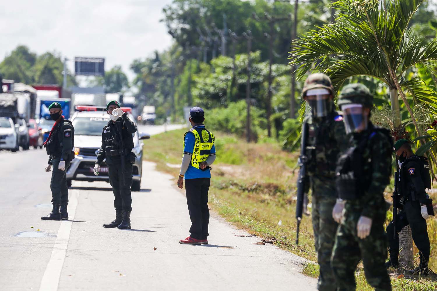 Thai government security personnel guard a highway checkpoint in Thailand's southern province of Pattani in April after the country went into lockdown. (AFP)