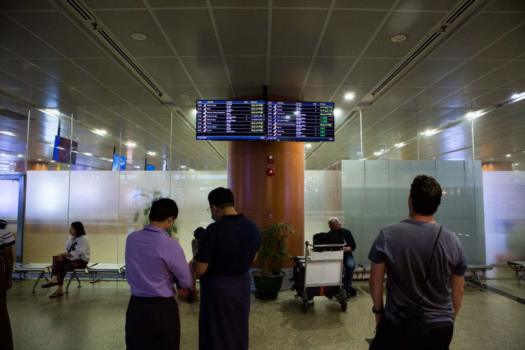 An arrivals board shows cancelled flights at Yangon International Airport on March 21, nine days before the government suspended all commercial flights into the country. (Thuya Zaw | Frontier)