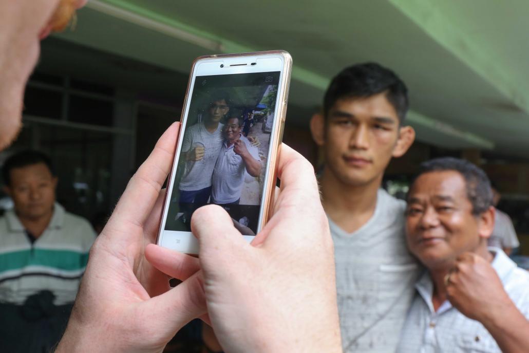  /></p><p>Returning to his childhood home, Aung La Nsang said it felt like he had been away a lifetime. He ate snacks that he missed from his youth and visited grandparents, even reconnecting with a street vendor who sold <em>moun sein baun</em> to him as a kid.</p><p>“She knew exactly who I was,” he said. “She knew I was the kid that she used to sell snacks to.”</p><p>No longer a child, he’s now many other things: a father who takes his young son to a Kachin Baptist Church in Maryland once a week for Sunday school with other Kachin language speakers; a cage fighter who will go up to 25 minutes in the ring with a man intent on destroying him; a bona fide celebrity in the country he left behind, graciously posing for selfies with grinning immigration officers at the Yangon Airport.</p><p>Did the snack seller in Myitkyina recognise him as the Burmese Python – the Myanmar superstar?</p><p>“I’m not so sure about that,” he said, tilting his head. “But she recognised me for who I am.” </p><p><strong><em>Additional reporting by Sam Aung Moon</em></strong></p></body>