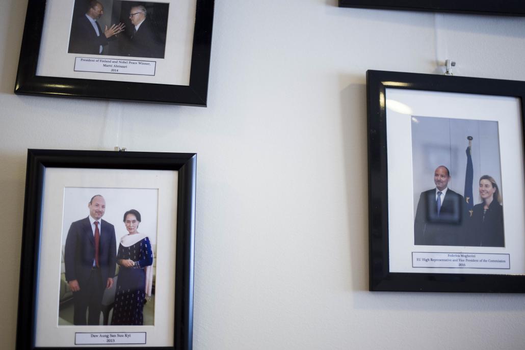 Photos on the wall inside the Yangon office of Roland Kobia, EU Ambassador to Myanmar. (Ann Wang / Frontier)