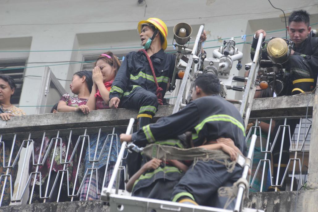  /></p><p>Kyi Win acquired his fire fighting skills at the country’s only training camp for fire fighters, known as Zee Bin Gyi, at Pyin Oo Lwin Township in Mandalay Region.</p><p>Ordinary firemen undergo three months’ basic training. In addition, officers receive six months of management training.</p><p>The training is mostly focused on theory, so when graduates are posted to stations they have little practical experience. Instead, they have to learn on the job, Kyi Win said.</p><p>“I hope the training will change soon so that the trainees are taught practical skills as well as the theory,” he said.</p><p>There are nearly 11,000 fire fighters throughout the country, but the Fire Services Department – which also has more than 300,000 volunteers who provide assistance during emergencies – is badly understaffed. Kyi Win says Myanmar needs more than 26,000 fire fighters.</p><p>“We are training about 2,000 firefighters a year to address the understaffing situation,” U Aung Swe Win, the deputy director of the Fire Services Department told <em>Frontier</em>, adding that the workforce had increased by more than 50 percent in two years as a result.</p><p>He said there was no shortage of applications, although most are for auxiliary rather than permanent positions. New recruits receive a basic salary of K120,000 a month, plus K1,500 a day.</p><h2 class=