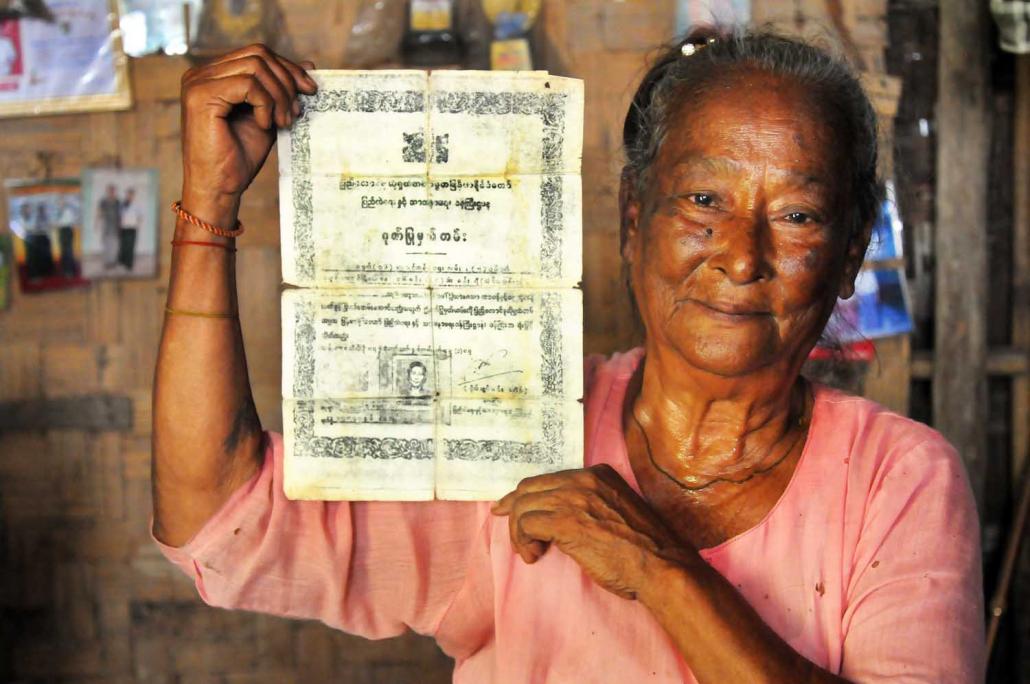 Daw San Yi displays the certificate given to her by the Burmese government for her role in capturing one of the North Korean assassins. (Steve Tickner | Frontier)