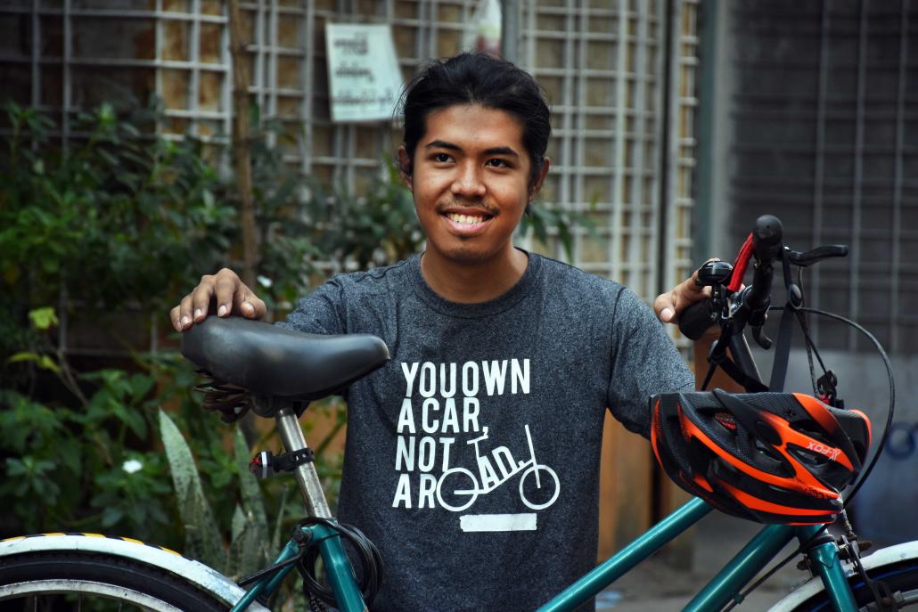 Zwe Pyae displays his bike in Yangon's Sanchaung Township. (Steve Tickner | Frontier)