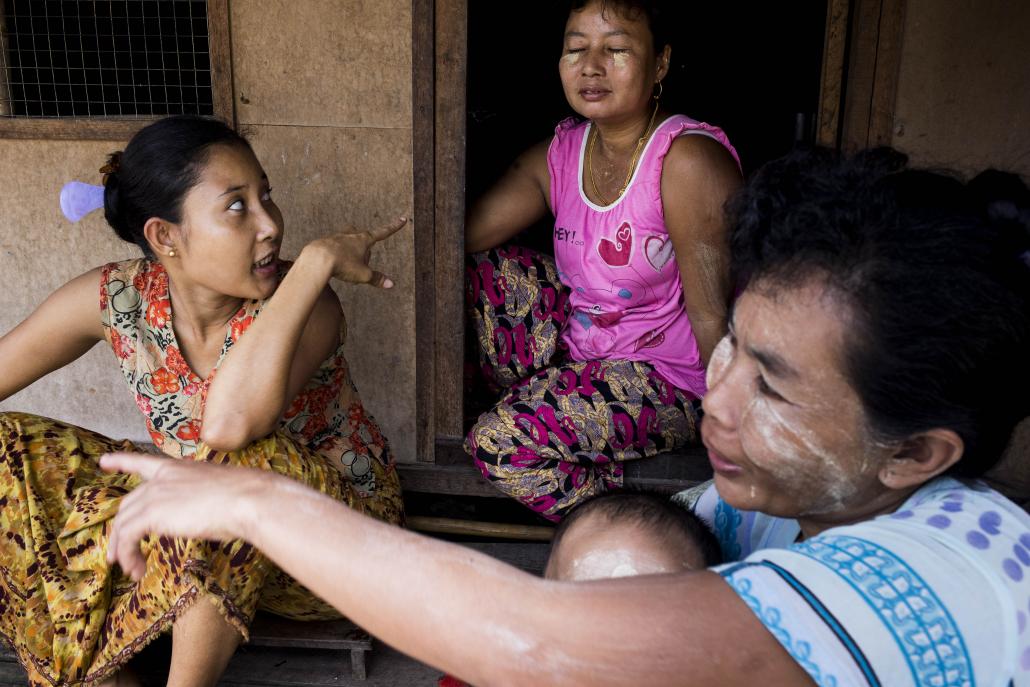 Ma Thi Thi Lwin, left, 31, moved to Hlaing Tharyar six years ago from Bogale Township in Ayeyarwady Region. She was unable to get a factory job because she lacked the minimum educational qualifications. (Ann Wang / Frontier)