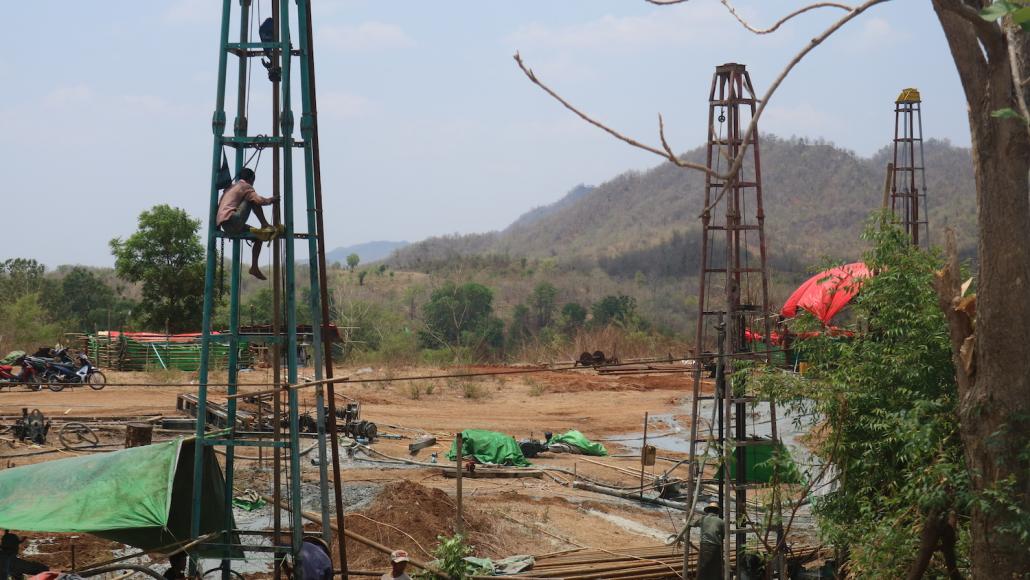 An oil worker on a derrick at the Htangaing field in Minhla Township. The field hosts 20,000 to 30,000 people. (Nay Aung | Frontier)