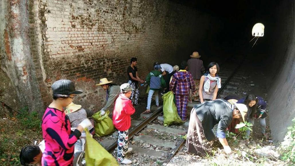 Members of the conservation group Inzein Myay collect litter near the Gokteik Viaduct in northern Shan State. (Inzein Myay | Supplied)