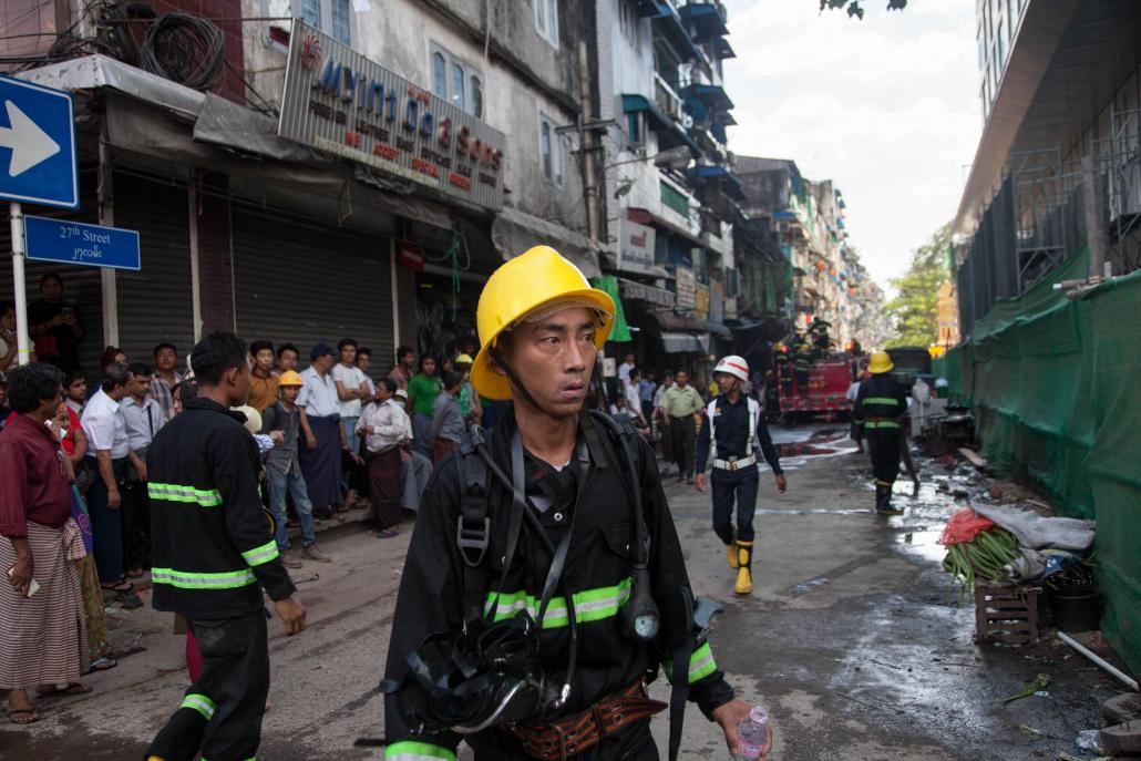  /></p><p>Among the dead firefighters were two from the headquarters, two from the Kyauktada Township fire station and one from Tarmwe.</p><p>The injured included Kyi Win, who in 2013 became head of the Yangon Region Fire Services Department.</p><p>“It’s our job to fight fires but I hope we never have another incident like that warehouse explosion,” he told <em>Frontier</em> recently.</p><h2 class=