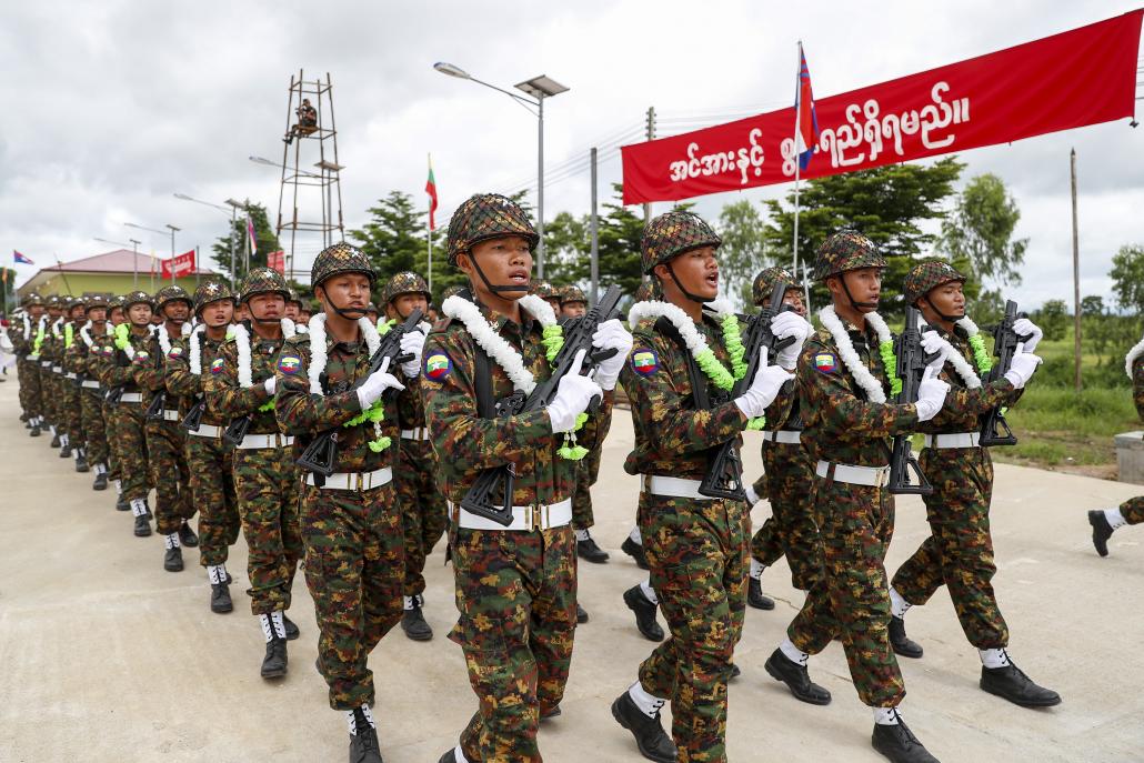 Soldiers of the Kayin State Border Guard Force parade for the armed group's ninth anniversary at its headquarters of Shwe Kokko Myaing on August 20, 2019. (Nyein Su Wai Kyaw Soe | Frontier)