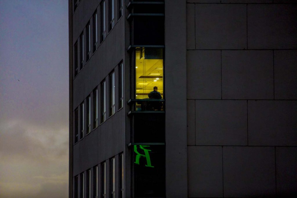 An office worker inside Sule Square in downtown Yangon on the evening of July 10. (Hkun Lat | Frontier)