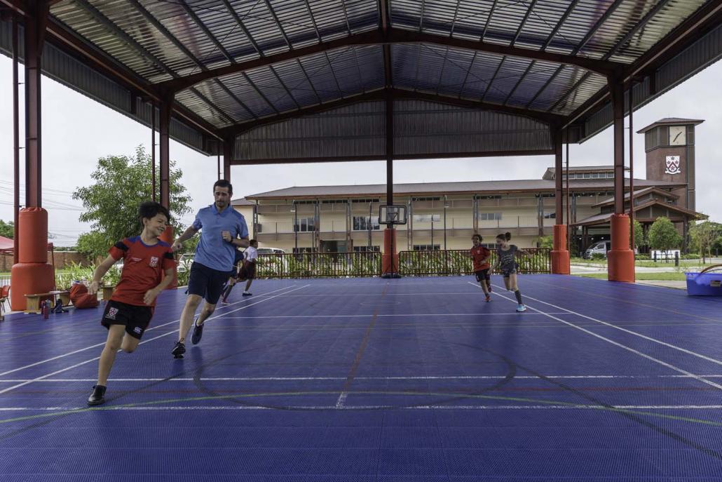 Students warming up for a sports lesson at Dulwich College Yangon.