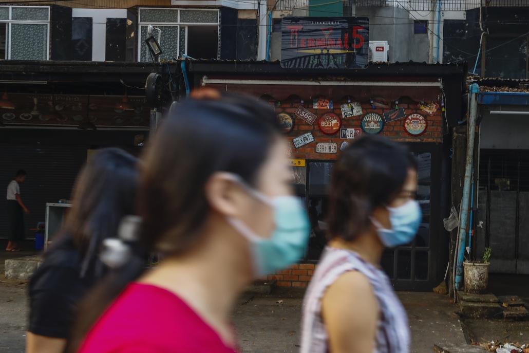 Bars in Sanchaung Township that are normally packed with customers every night of the week are now closed, but elsewhere in Yangon it's a different story. (Nyein Su Wai Kyaw Soe | Frontier)