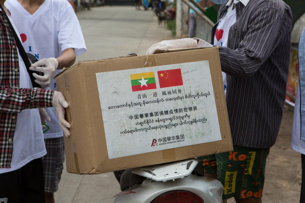 A box of facemasks donated by China’s Panhua Group to local charity “We Love Insein”. (Thuya Zaw | Frontier)