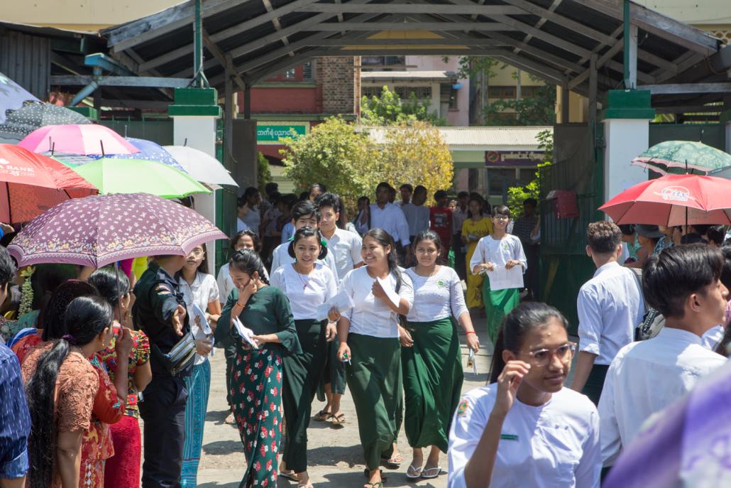 Students leave a school in Yangon's Mingalar Taung Nyunt Township after sitting a matriculation exam in March. (Thuya Zaw | Frontier)