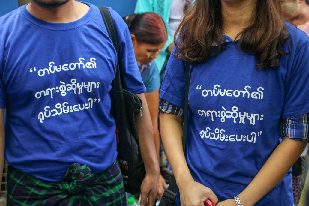 Youth activists attending U Min Htin Ko Ko Gyi's trial on May 23 wear t-shirts demanding that numerous 